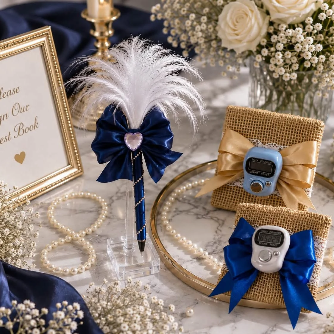 Coordinated navy satin bows, pearl details, feather pen, and handmade celebration favors